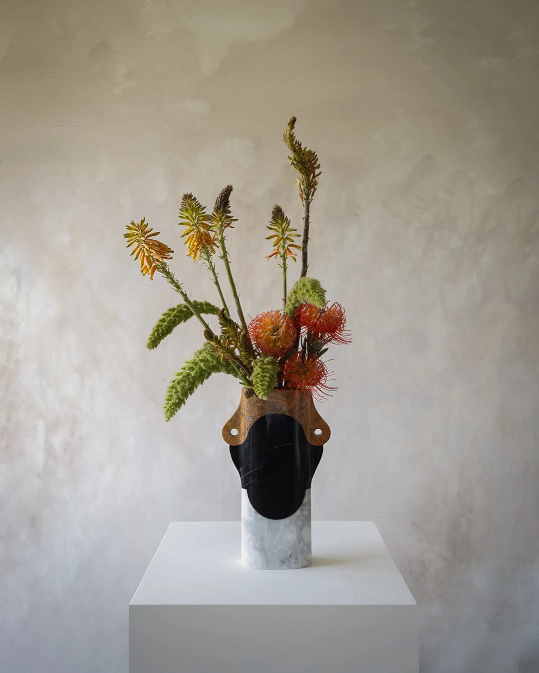 Abstracted Ancestry II.I vase in venetian marble, orizaba black marble, red travertine — studio view