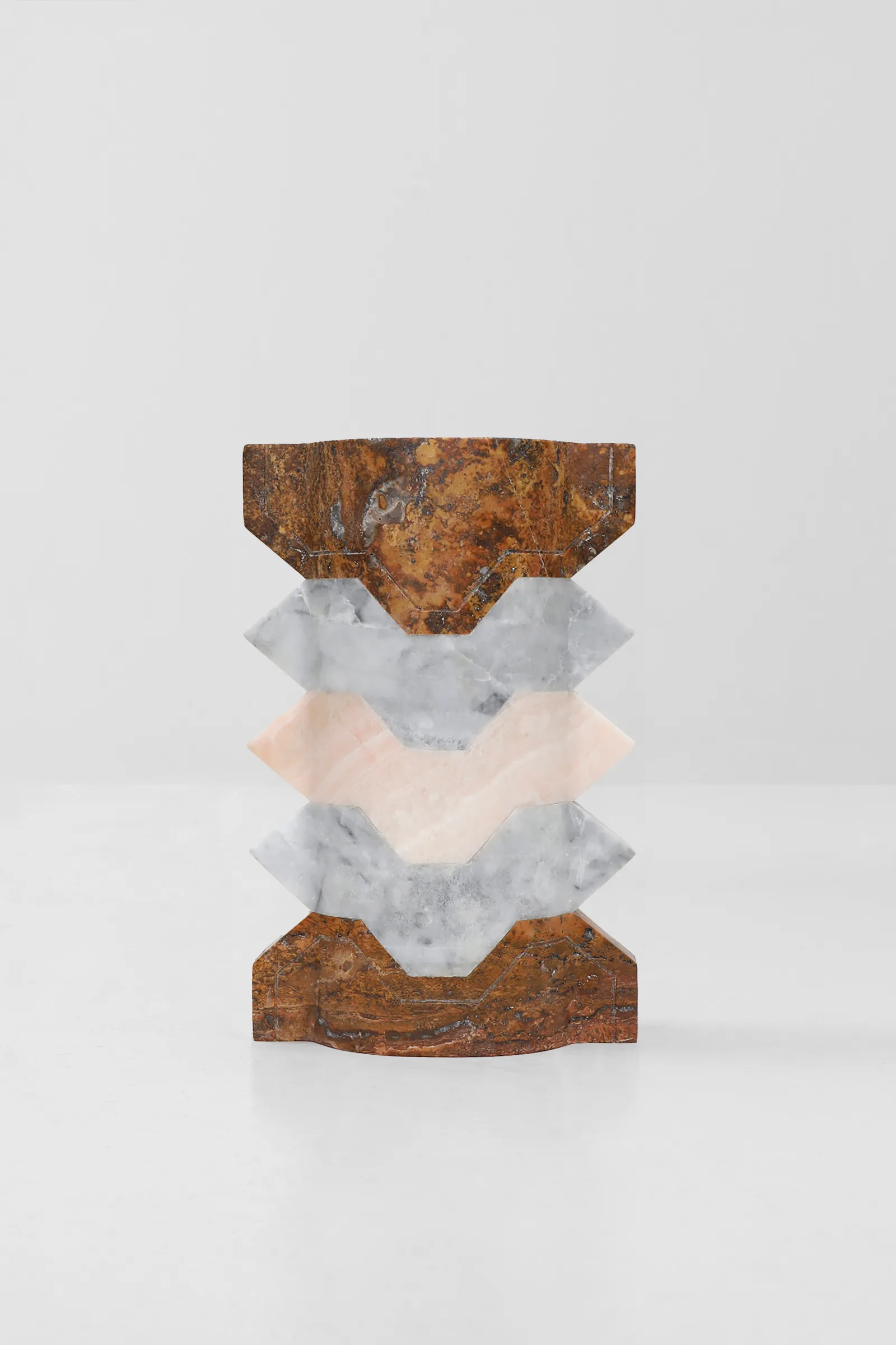 Místico III.II vase in red travertine, venetian marble, pink onyx — view of the work