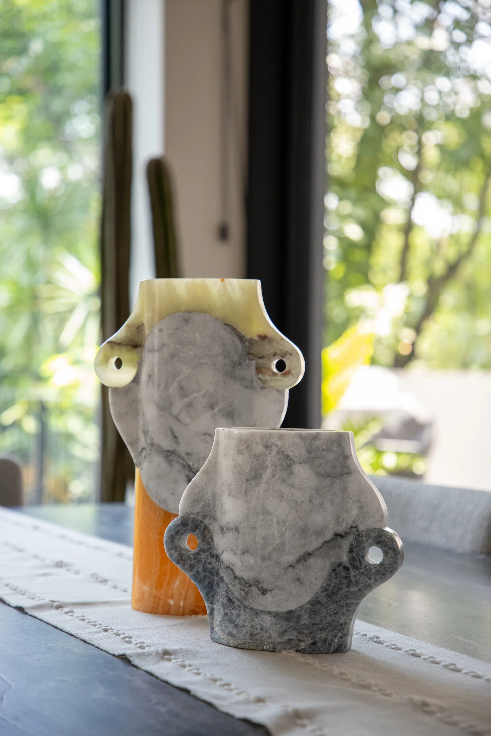 Abstracted Ancestry II.II vase in green talan onyx, venetian marble, pineapple onyx — studio view