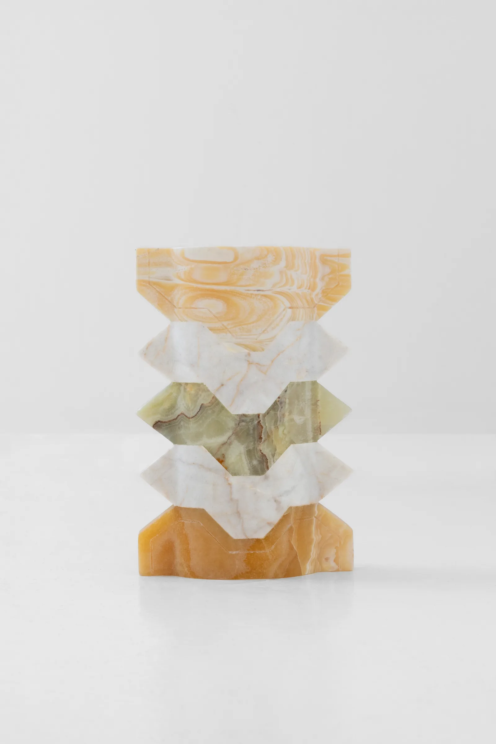 Místico III.I vase in pineapple onyx, venetian marble, talan green onyx — studio view