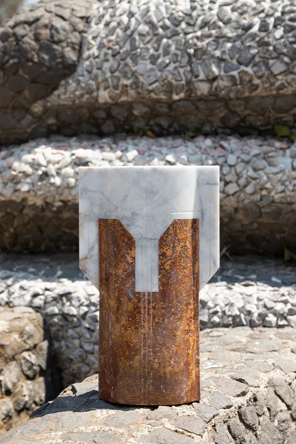 Místico IV.II vase in venetian marble, red travertine — exhibition view