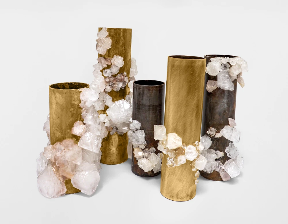 Contemporary sculpture co-creation, freely forming crystals on brass and steel tubes