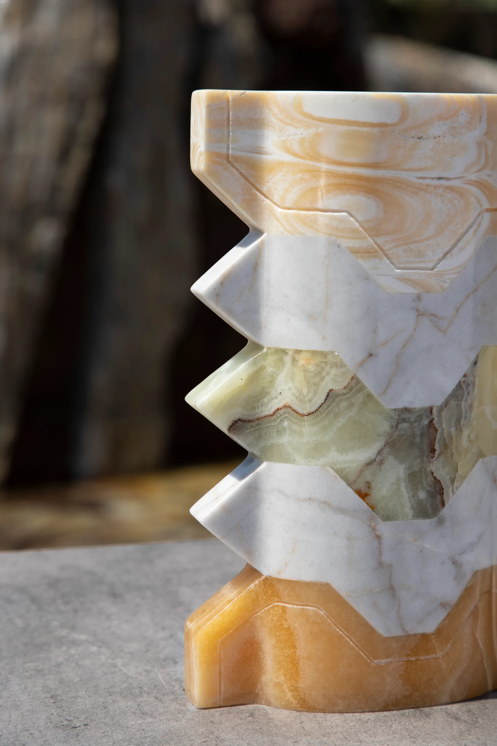 Místico III.I vase in pineapple onyx, venetian marble, talan green onyx — studio view