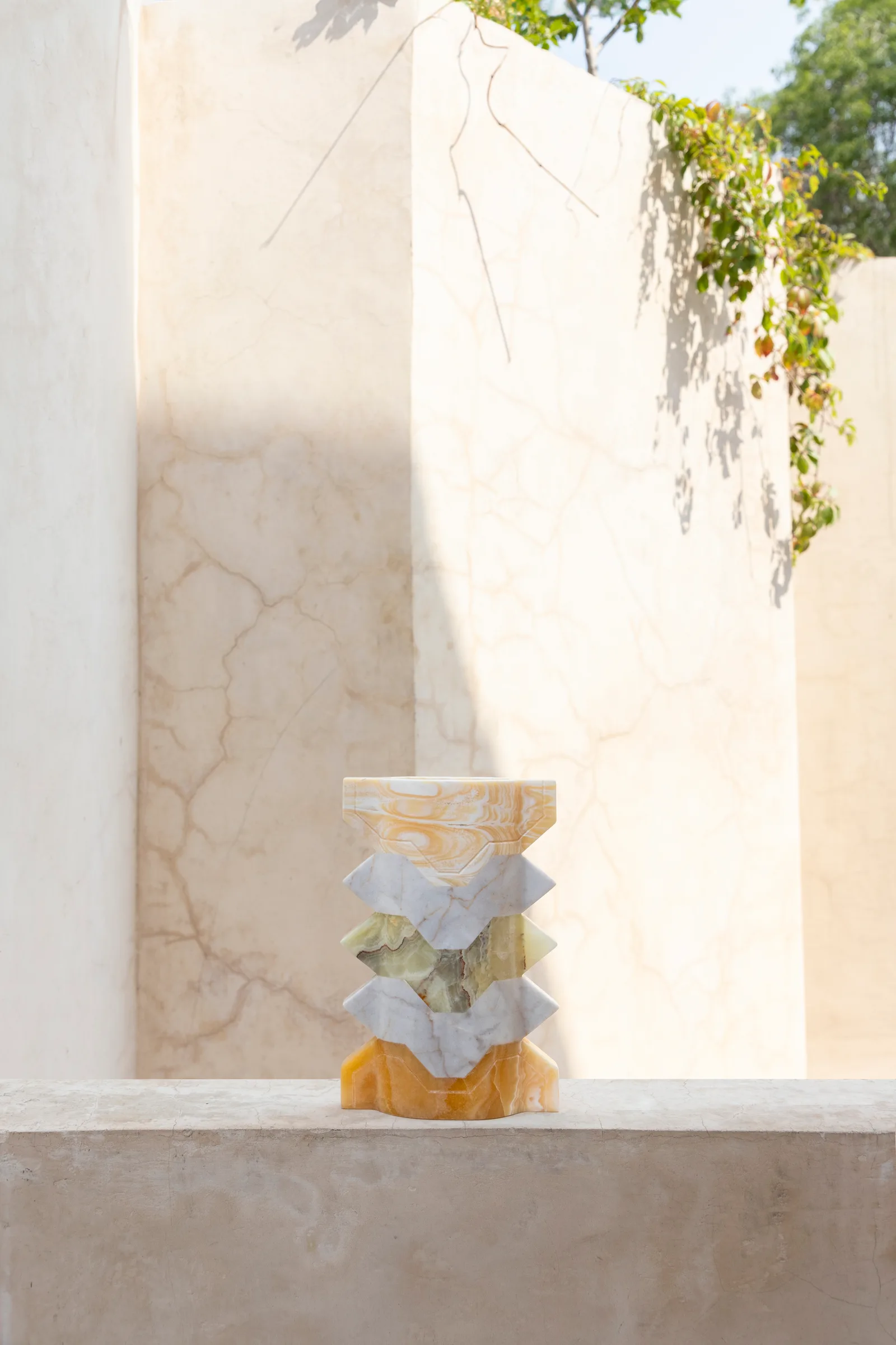 Místico III.I vase in pineapple onyx, venetian marble, talan green onyx — studio view