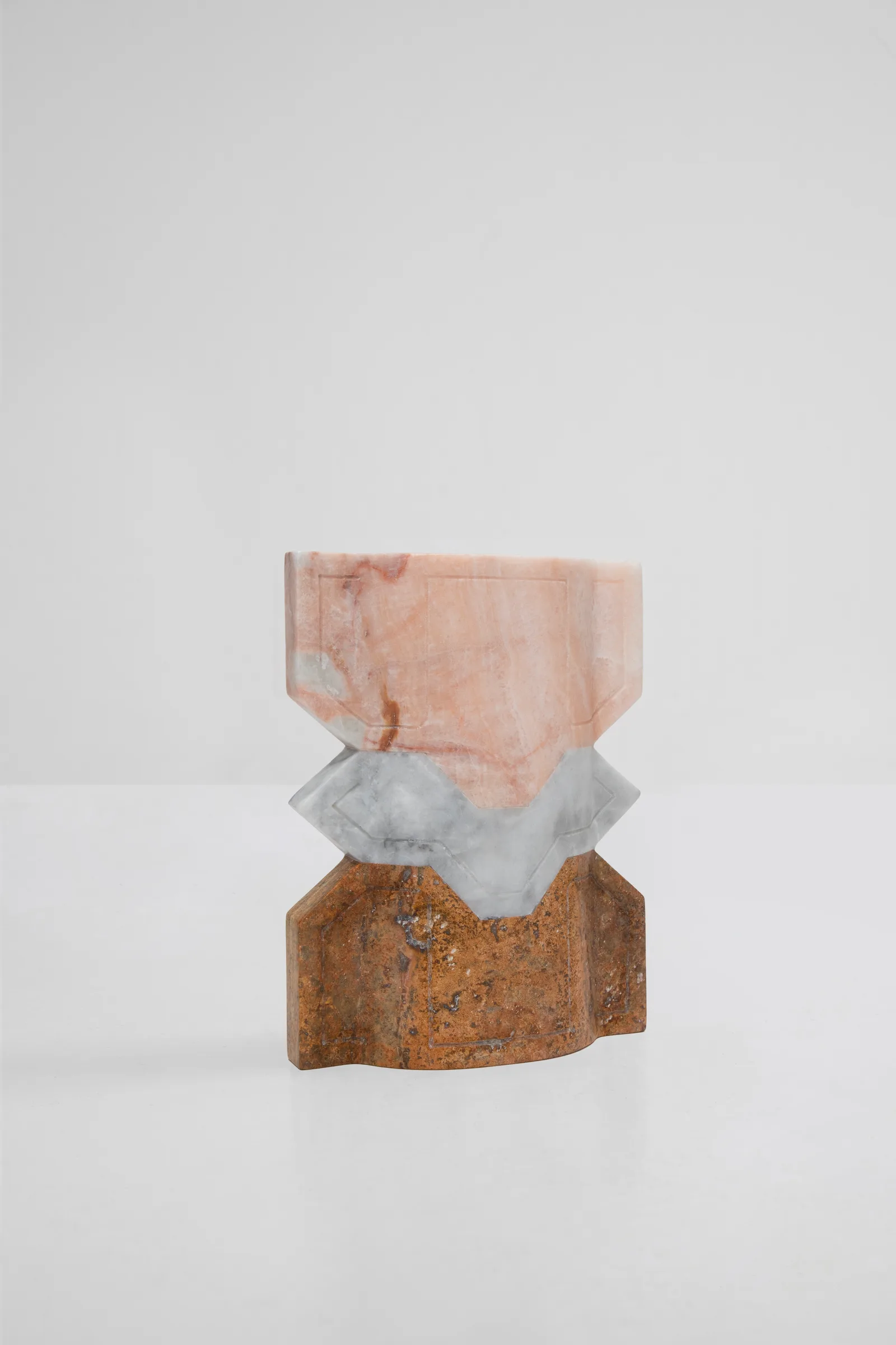 Místico II.II vase in pink onyx, venetian marble, red travertine — studio view