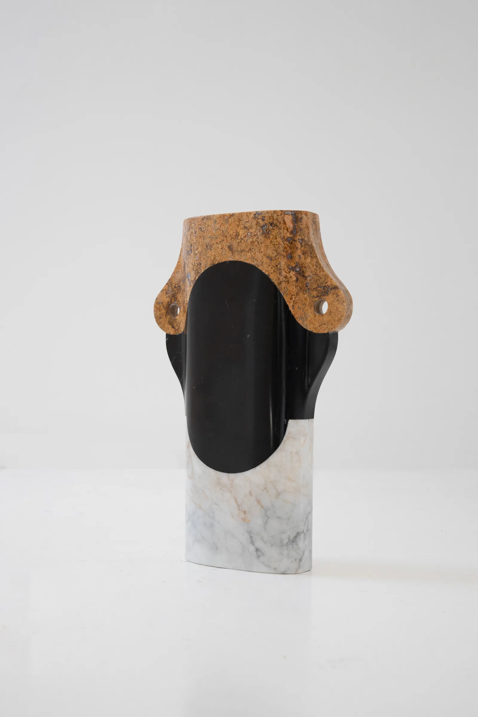 Abstracted Ancestry II.I vase in venetian marble, orizaba black marble, red travertine — studio view