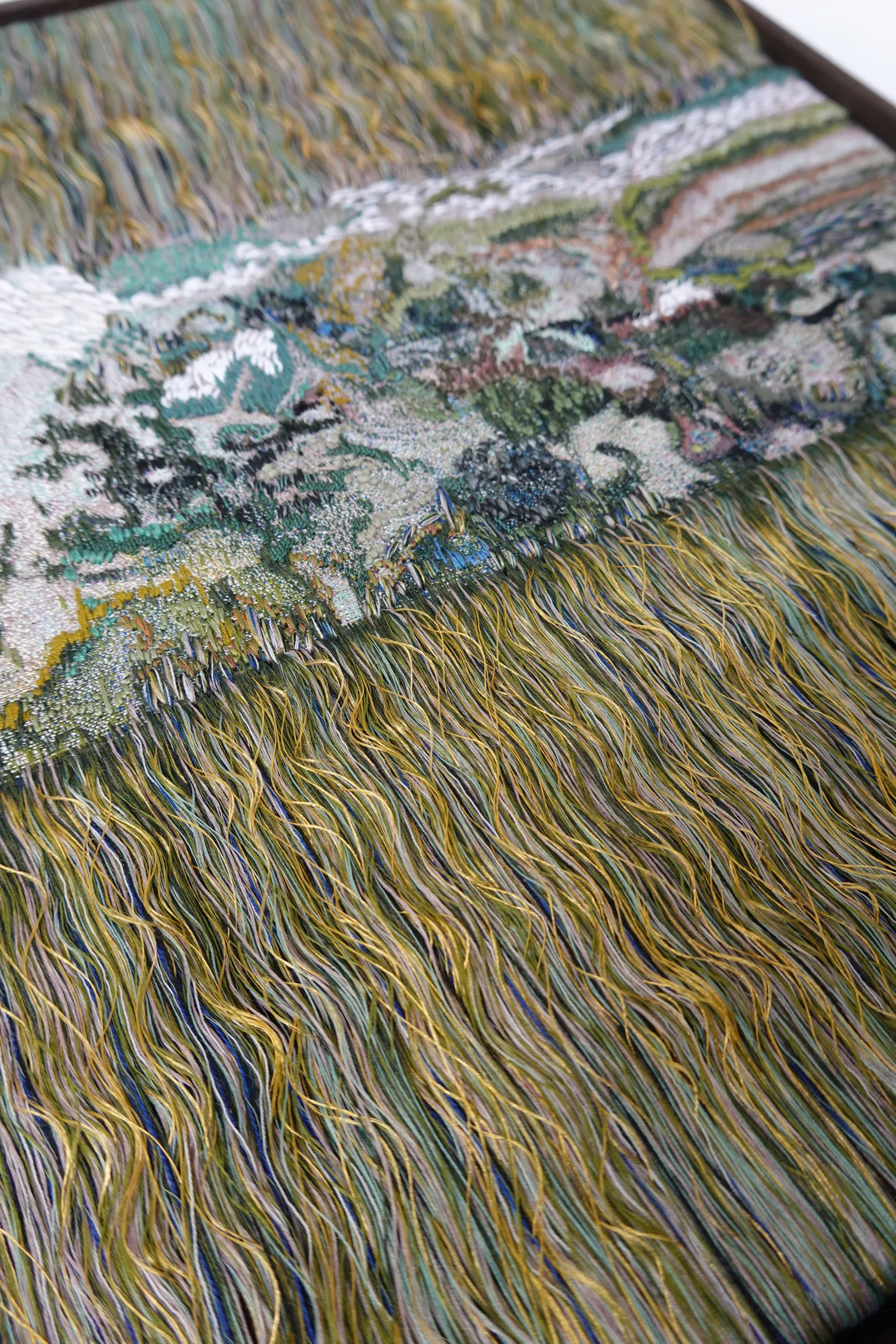 Metamorphic 01, woven and embroidered textile with fringe — view of the work