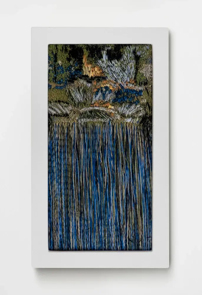Embroidered tapestry with cascading blue threads depicting species migration